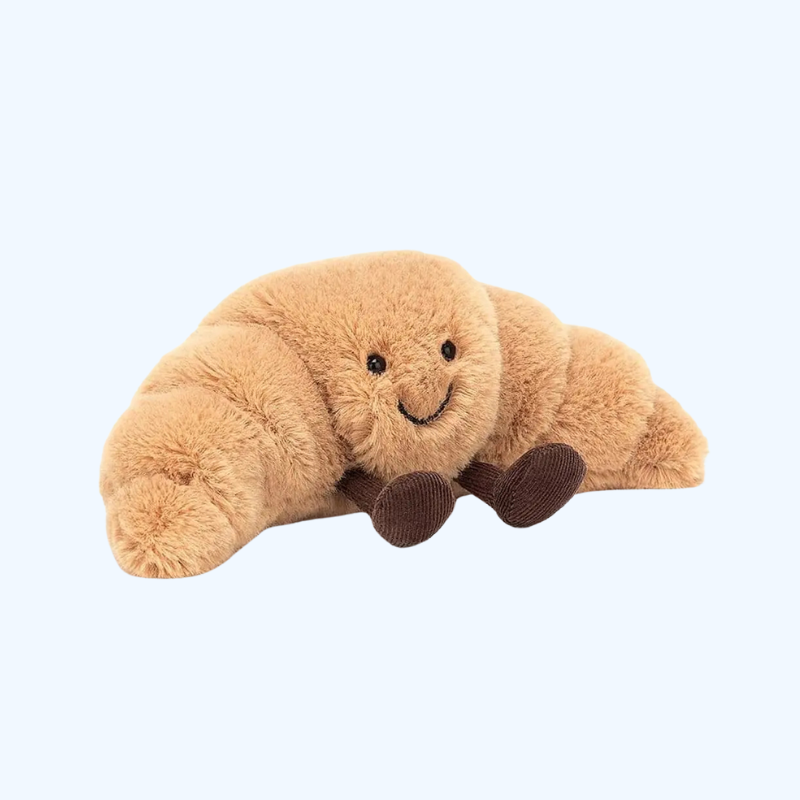 SnuggleCrumb™ – Smiling Croissant Plush Toy – Soft Cuddly Pillow