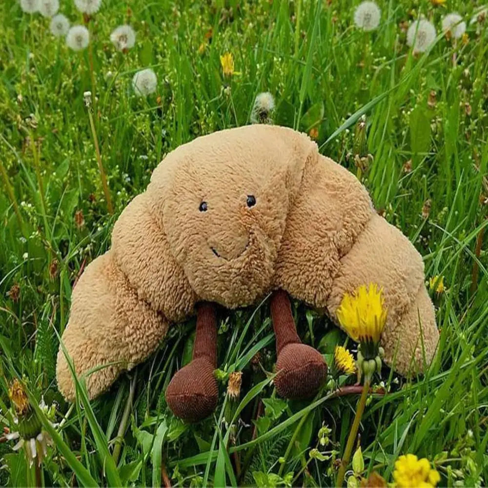 SnuggleCrumb™ – Smiling Croissant Plush Toy – Soft Cuddly Pillow