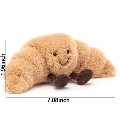 SnuggleCrumb™ – Smiling Croissant Plush Toy – Soft Cuddly Pillow